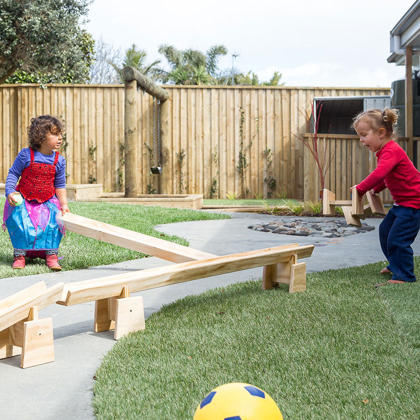 Two kids playing outside at Spotted Frog Preschool