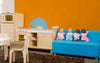 Inside Spotted Frog Preschool. Blue couch & dolls